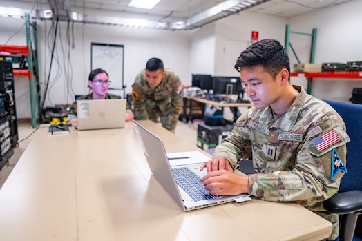  A U.S. Space Force Guardian assigned to the 527th Space Aggressor Squadron, right, monitors electromagnetic range activity during exercise Resolute Space 2025 in Colorado Springs, Colo., July 29, 2025. The 527th SAS replicated adversary electromagnetic tactics, techniques and procedures during Resolute Space 2025 to challenge participants in contested conditions. (U.S. Space Force photo by Isaac Blancas)