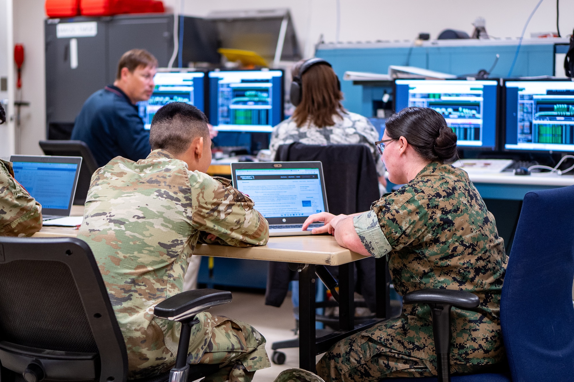 Joint military and civilian members assigned to the 25th Space Range Squadron, the 379th Space Range Squadron, and the 527th Space Aggressor Squadron, conduct range and aggressor activities during exercise Resolute Space 2025 in Colorado Springs, Colo., July 29, 2025. The 25th SRS and 379th SRS supported Resolute Space, Resolute Forces Pacific (REFORPAC) and the broader Department-Level Exercise with an electromagnetic range environment for realistic training, while the 527th SAS replicated adversary electromagnetic tactics, techniques and procedures to test participants in contested conditions. (U.S. Space Force photo by Isaac Blancas)