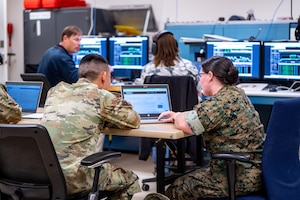 Joint military and civilian members assigned to the 25th Space Range Squadron, the 379th Space Range Squadron, and the 527th Space Aggressor Squadron, conduct range and aggressor activities during exercise Resolute Space 2025 in Colorado Springs, Colo., July 29, 2025. The 25th SRS and 379th SRS supported Resolute Space, Resolute Forces Pacific (REFORPAC) and the broader Department-Level Exercise with an electromagnetic range environment for realistic training, while the 527th SAS replicated adversary electromagnetic tactics, techniques and procedures to test participants in contested conditions. (U.S. Space Force photo by Isaac Blancas)