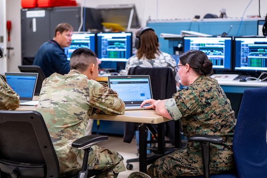  Joint military and civilian members assigned to the 25th Space Range Squadron, the 379th Space Range Squadron, and the 527th Space Aggressor Squadron, conduct range and aggressor activities during exercise Resolute Space 2025 in Colorado Springs, Colo., July 29, 2025. The 25th SRS and 379th SRS supported Resolute Space, Resolute Forces Pacific (REFORPAC) and the broader Department-Level Exercise with an electromagnetic range environment for realistic training, while the 527th SAS replicated adversary electromagnetic tactics, techniques and procedures to test participants in contested conditions. (U.S. Space Force photo by Isaac Blancas)