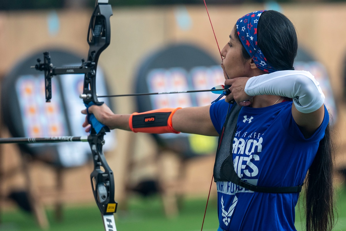 Tech. Sgt. Jessica Garcia, Team Air Force athlete, draws her bow during archery qualifiers at the Department of Defense Warrior Games in Colorado Springs, Colo., July 24, 2025. Athletes competed in standing and seated categories, divided further by compound and recurve bows. (U.S. Air Force photo by Senior Airman Sophia Robello)