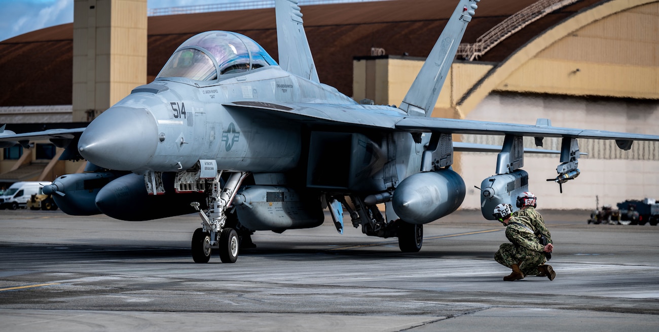 U.S. Navy personnel perform pre-flight checks for an EA-18G Growler assigned to the Electronic Attack Squadron (VAQ) 138 before taxiing during Red Flag-Alaska 25-3 at Eielson Air Force Base, Alaska, July 22, 2025.