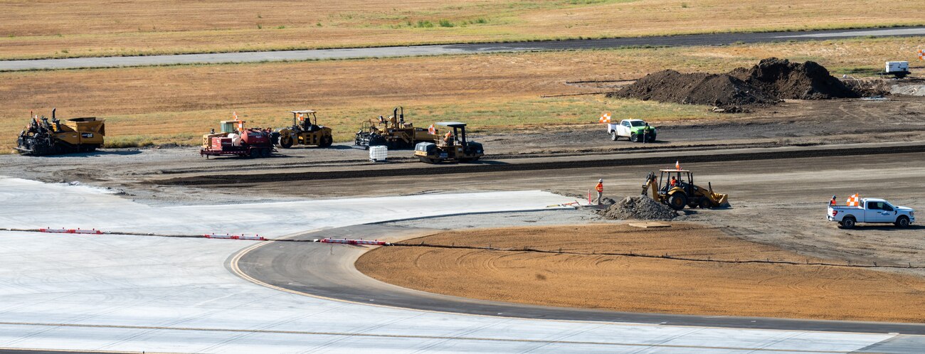 View from air traffic control tower of construction crew working on flight line