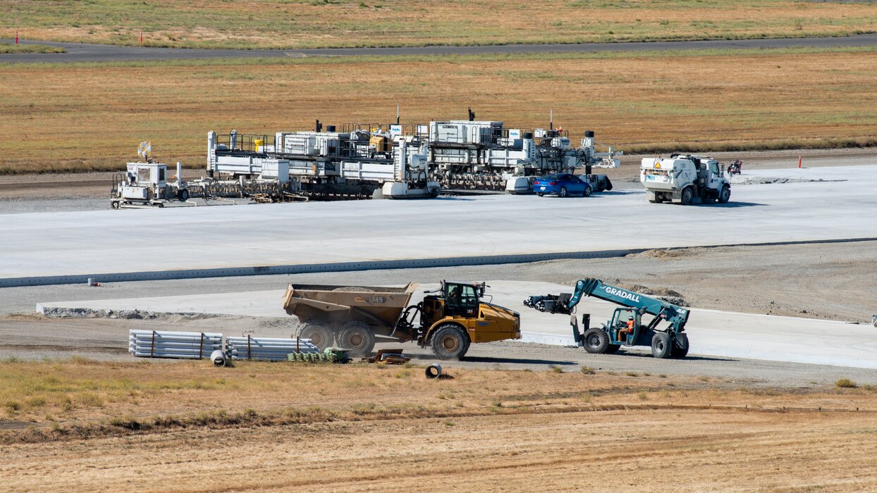 View from air traffic control tower of construction crew working on flight line