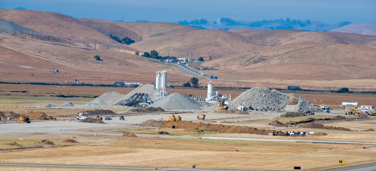 View from air traffic control tower of construction crew working on flight line