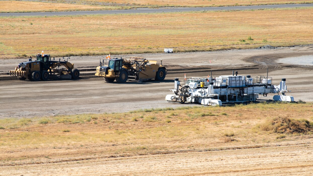 View from air traffic control tower of construction crew working on flight line