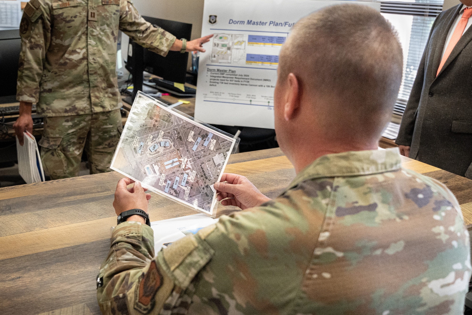 U.S. Air Force Chief Master Sgt. Courtney Freeman, command chief of Air Force Special Operations Command, attends a brief hosted by dorm management at Cannon Air Force Base, New Mexico, July 28, 2025. Freeman learned about challenges with the dormitories and initiatives to improve the quality of life and living conditions for Airmen. (U.S. Air Force photo by Senior Airman Sarah Gottschling)