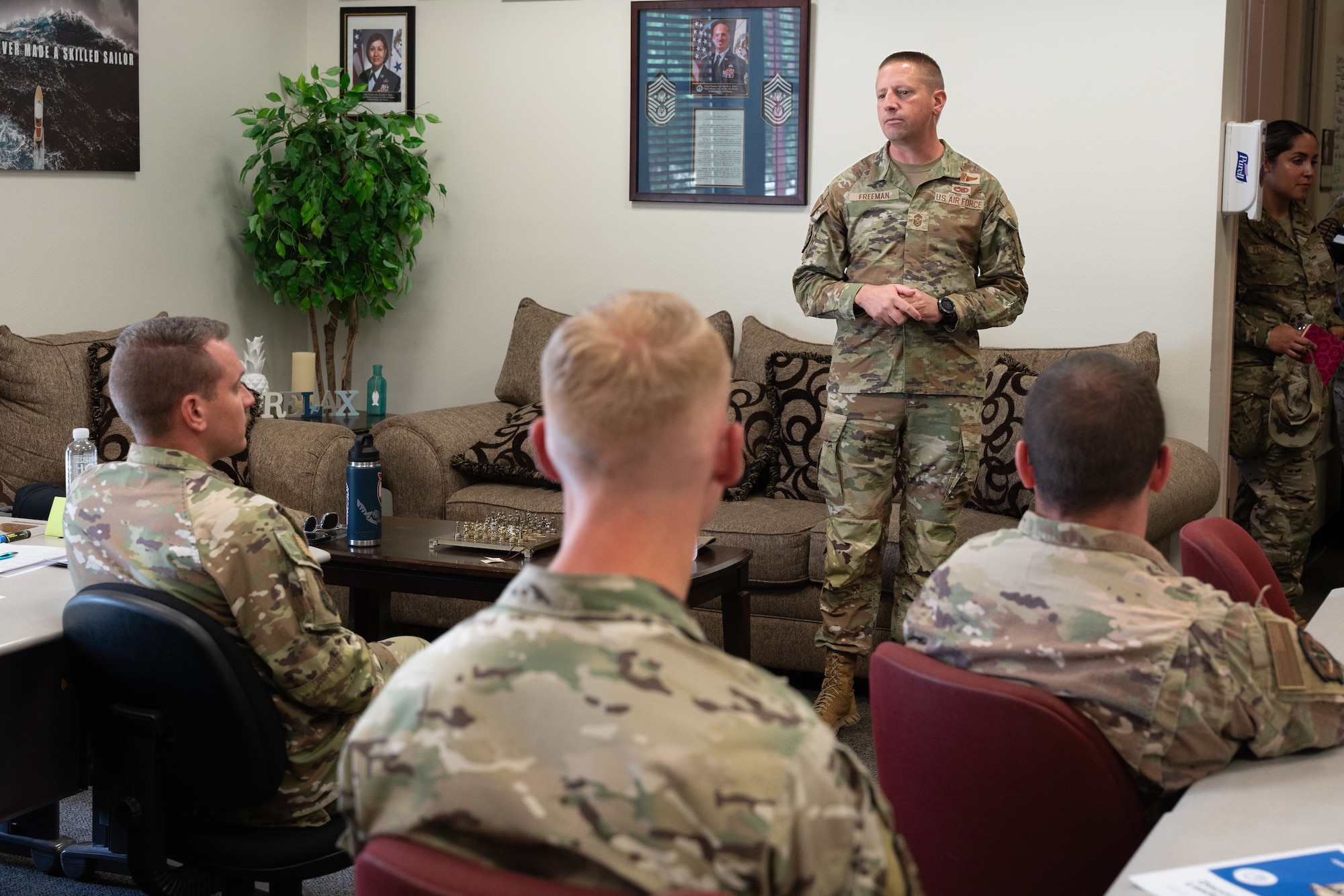 U.S. Air Force Chief Master Sgt. Courtney Freeman, command chief of Air Force Special Operations Command, attends a Professional Development Center brief at Cannon Air Force Base, New Mexico, July 28, 2025. The Professional Development Center is designed to teach Air Commandos principles of leadership, work ethic, team building, and other valuable traits necessary to be a good leader. (U.S. Air Force photo by Senior Airman Sarah Gottschling)