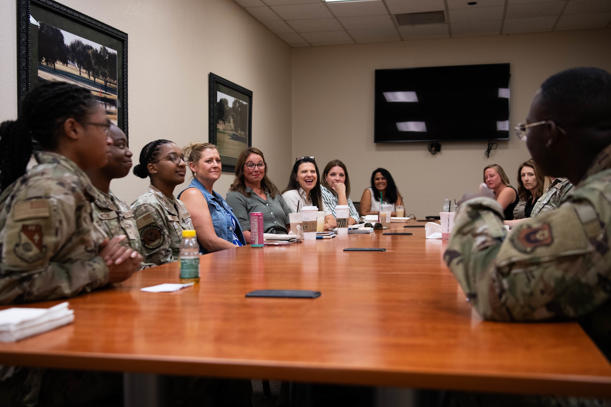 Melissa Conley, spouse of U.S. Air Force Lt. Gen. Michael Conley, commander of Air Force Special Operations Command; and Becky Freeman, spouse of U.S. Air Force Chief Master Sgt. Courtney Freeman, command chief AFSOC, meet with dorm council Airmen at Cannon Air Force Base, N.M., July 28,  2025. The dorm council is comprised of responsible Airmen who advocate for single Airmen and their needs. (U.S. Air Force photo by Maj. Jaclyn Pienkowski)