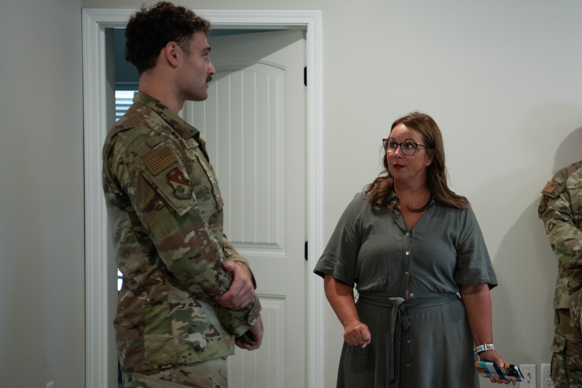 Melissa Conley, spouse of U.S. Air Force Lt. Gen. Michael Conley, commander of Air Force Special Operations Command, talks with an Air Commando and resident of Sendero, LLC, about his experience living in the off-base dormitory. Sendero, LLC is part of Cannon AFB’s solution to unaccompanied housing capacity challenges. (U.S. Air Force photo by Maj. Jaclyn Pienkowski)