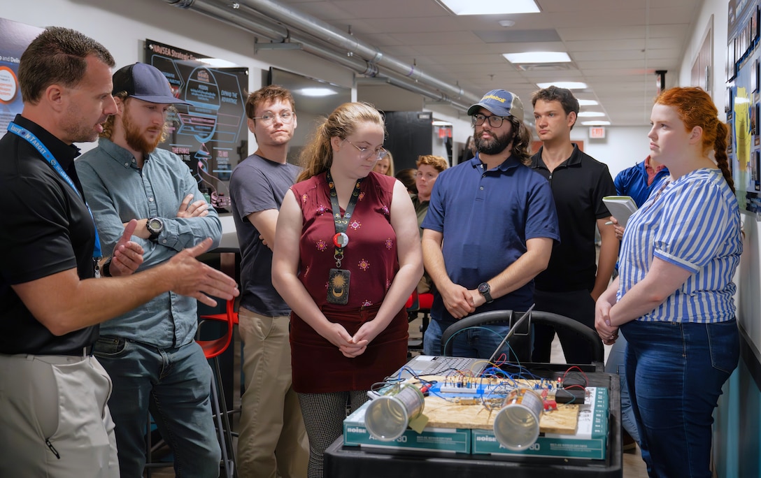 DAHLGREN, Va. – Derek Diltz (left), chief engineer in the High Power Microwave Weapon Systems Division at Naval Surface Warfare Center Dahlgren Division (NSWCDD), speaks to a group of early-career scientists and engineers during a Workforce Development Innovation Challenge. (Tierney Kunstmann/NSWCDD Photo)
