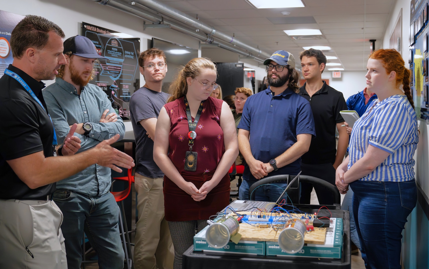 DAHLGREN, Va. – Derek Diltz (left), chief engineer in the High Power Microwave Weapon Systems Division at Naval Surface Warfare Center Dahlgren Division (NSWCDD), speaks to a group of early-career scientists and engineers during a Workforce Development Innovation Challenge. (Tierney Kunstmann/NSWCDD Photo)