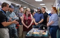 DAHLGREN, Va. – Derek Diltz (left), chief engineer in the High Power Microwave Weapon Systems Division at Naval Surface Warfare Center Dahlgren Division (NSWCDD), speaks to a group of early-career scientists and engineers during a Workforce Development Innovation Challenge. (Tierney Kunstmann/NSWCDD Photo)