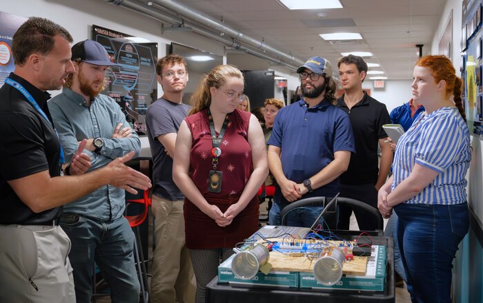 DAHLGREN, Va. – Derek Diltz (left), chief engineer in the High Power Microwave Weapon Systems Division at Naval Surface Warfare Center Dahlgren Division (NSWCDD), speaks to a group of early-career scientists and engineers during a Workforce Development Innovation Challenge. (Tierney Kunstmann/NSWCDD Photo)