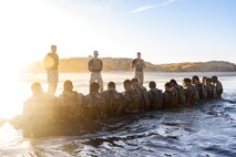 U.S. Marines with 1st Reconnaissance Battalion, 1st Marine Division, do squad sit-ups during the Martial Arts Instructor Course 99-25 culminating event at Marine Corps Base Camp Pendleton, California, July 9, 2025. Marines attend MAI courses to develop the skills, knowledge, and resilience required to instruct and certify Marines through the Marine Corps Martial Arts Program, enhancing their unit’s combat effectiveness and physical readiness. (U.S. Marine Corps photo by Lance Cpl. Jonathan Sherchand)