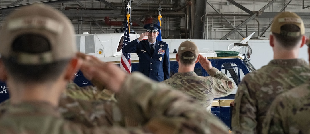 U.S. Air Force Col. Kevin Geoffroy, incoming 316th Operations Group commander, renders his first salute as the new commander of the 316th Operations Group during a change of command ceremony at Joint Base Andrews, Md., July 31, 2025.
