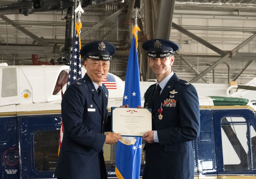 U.S. Air Force Col. Matthew Shrull, outgoing 316th Operations Group commander, receives the Legion of Merit from U.S. Air Force Col. Jun Oh, 316th Wing and installation commander, during a change of command ceremony at Joint Base Andrews, Md., July 31, 2025.