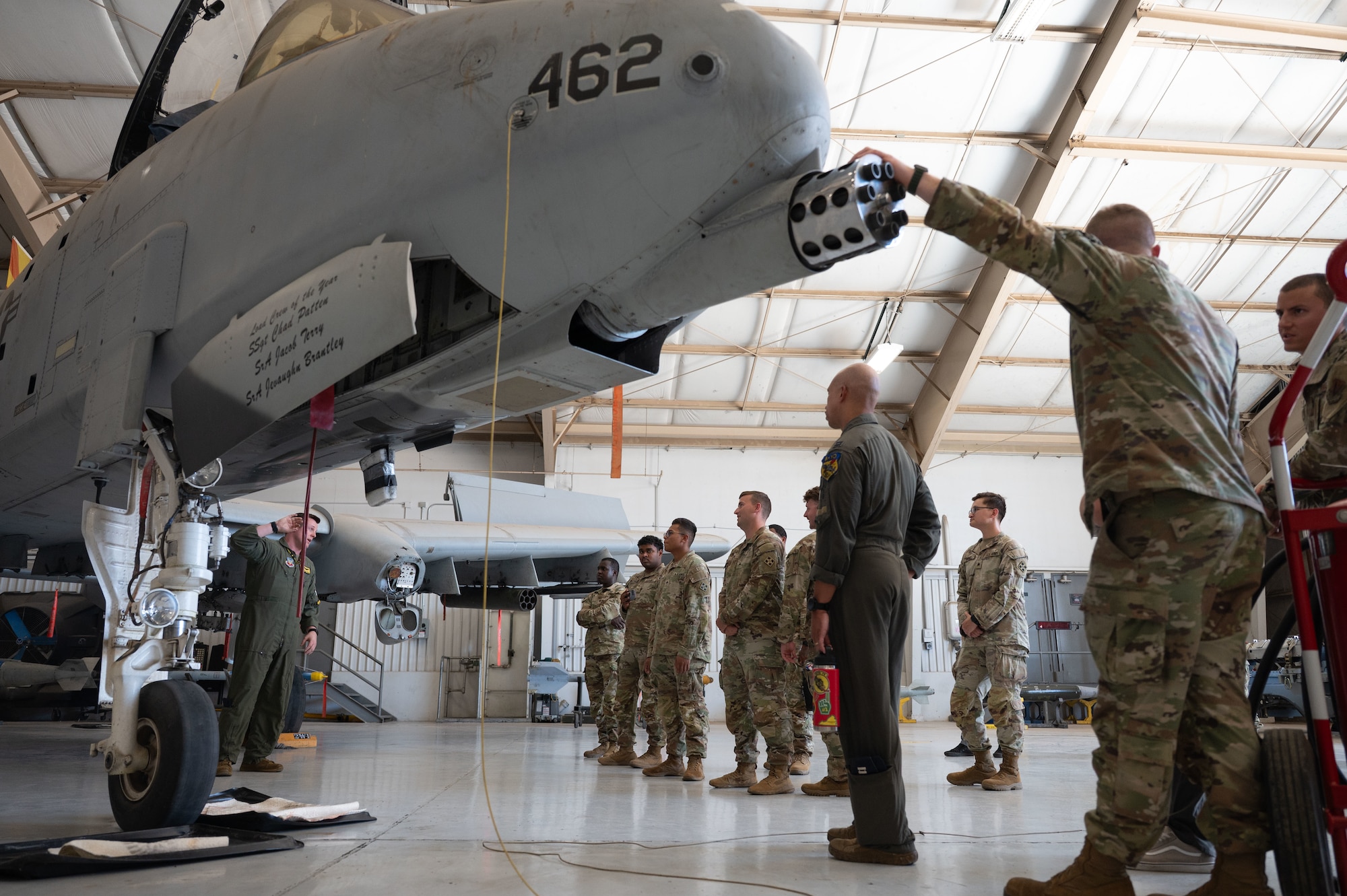 U.S. Army soldiers from the 12th Infantry Regiment learn about the A-10C Thunderbolt II at Davis-Monthan Air Force Base, Arizona, July 25, 2025. The soldiers were invited to DM to tour an A-10 hangar and learn about its equipment and weapons. (U.S. Air Force photo by Airman Jaden Kidd)