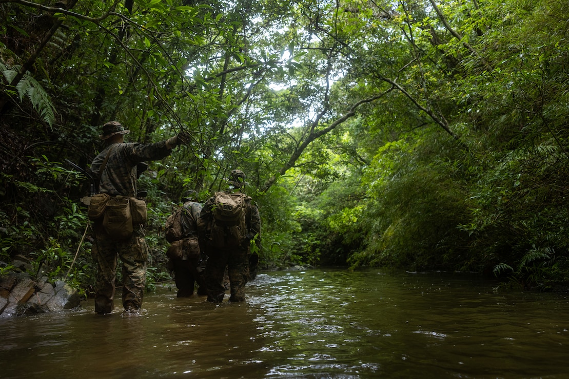U.S. Marines patrol during Expeditionary Advanced Base Field Training Exercise at the Central Training Area, Okinawa, Japan, July 28, 2025.