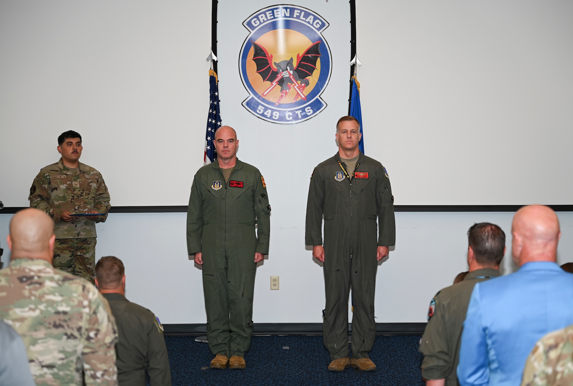 U.S. Air Force Lt. Col. Andrew W. Baumgart, outgoing 706th Aggressor Squadron (AGRS) commander, relinquished command to Lt. Col. Kristin L. Hollrith, incoming 706th AGRS commander, during a change of command ceremony at Nellis Air Force Base, Nevada, August 1, 2025.