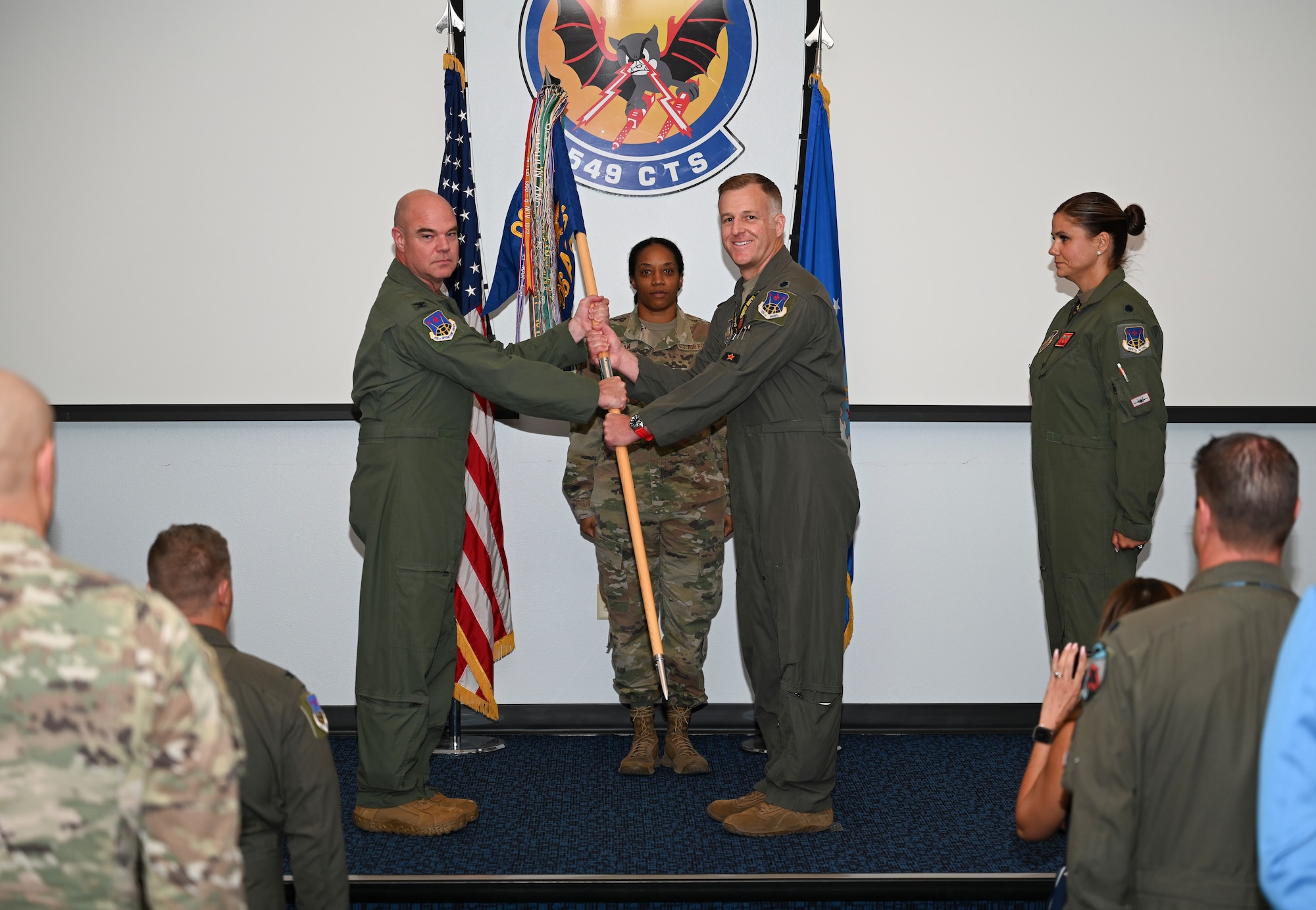 U.S. Air Force Lt. Col. Andrew W. Baumgart, outgoing 706th Aggressor Squadron (AGRS) commander, relinquished command to Lt. Col. Kristin L. Hollrith, incoming 706th AGRS commander, during a change of command ceremony at Nellis Air Force Base, Nevada, August 1, 2025.