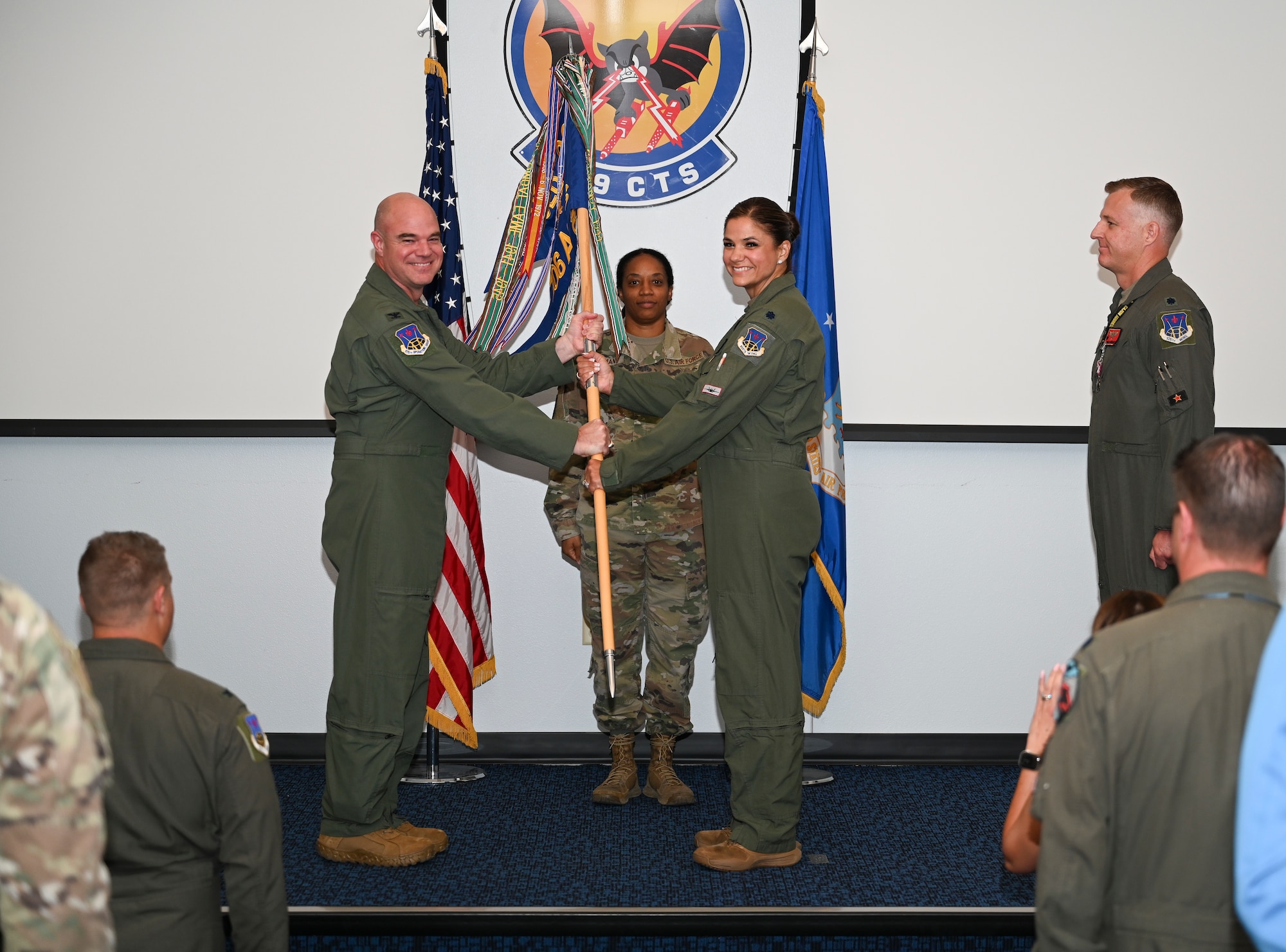 U.S. Air Force Lt. Col. Andrew W. Baumgart, outgoing 706th Aggressor Squadron (AGRS) commander, relinquished command to Lt. Col. Kristin L. Hollrith, incoming 706th AGRS commander, during a change of command ceremony at Nellis Air Force Base, Nevada, August 1, 2025.