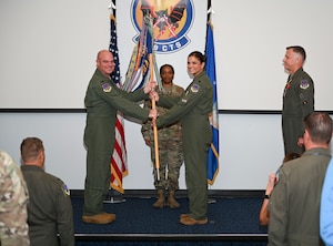 U.S. Air Force Lt. Col. Andrew W. Baumgart, outgoing 706th Aggressor Squadron (AGRS) commander, relinquished command to Lt. Col. Kristin L. Hollrith, incoming 706th AGRS commander, during a change of command ceremony at Nellis Air Force Base, Nevada, August 1, 2025.