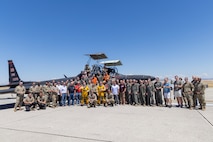 Cory “ULTRALORD” Bartholomew, 1st Reconnaissance Squadron (RS) assigned flight safety officer and U-2 instructor pilot, and Lt. Col. “JETHRO”, 1st RS instructor pilot and U-2 chief pilot, pose with all the members who made their flight possible, including from the 9th Reconnaissance Wing, 1st RS, 9th Physiological Support Squadron, and 9th Aircraft Maintenance Squadron, after landing a TU-2S Dragon Lady at Beale Air Force Base (AFB), California, Aug. 1st, 2025.