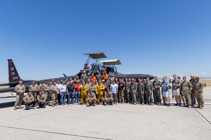 Cory “ULTRALORD” Bartholomew, 1st Reconnaissance Squadron (RS) assigned flight safety officer and U-2 instructor pilot, and Lt. Col. “JETHRO”, 1st RS instructor pilot and U-2 chief pilot, pose with all the members who made their flight possible, including from the 9th Reconnaissance Wing, 1st RS, 9th Physiological Support Squadron, and 9th Aircraft Maintenance Squadron, after landing a TU-2S Dragon Lady at Beale Air Force Base (AFB), California, Aug. 1st, 2025.