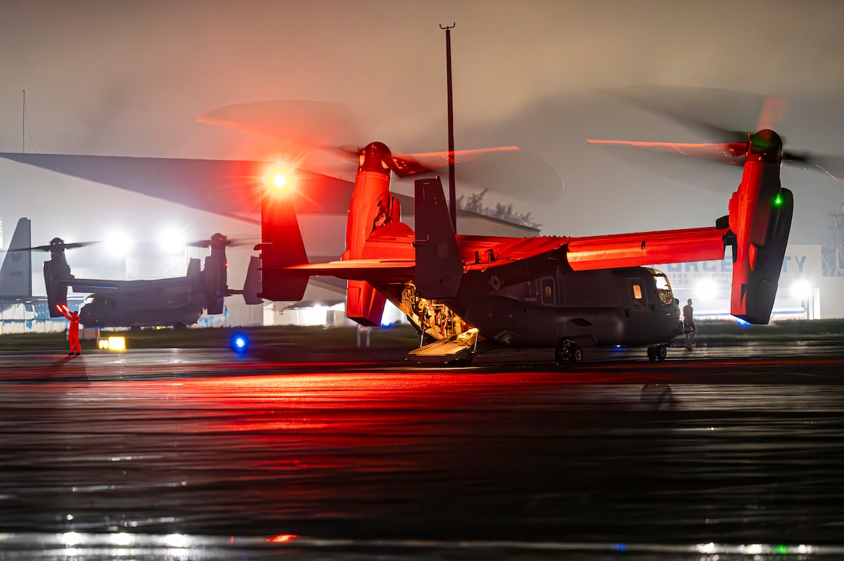 CV-22 sits on runway with engines on.