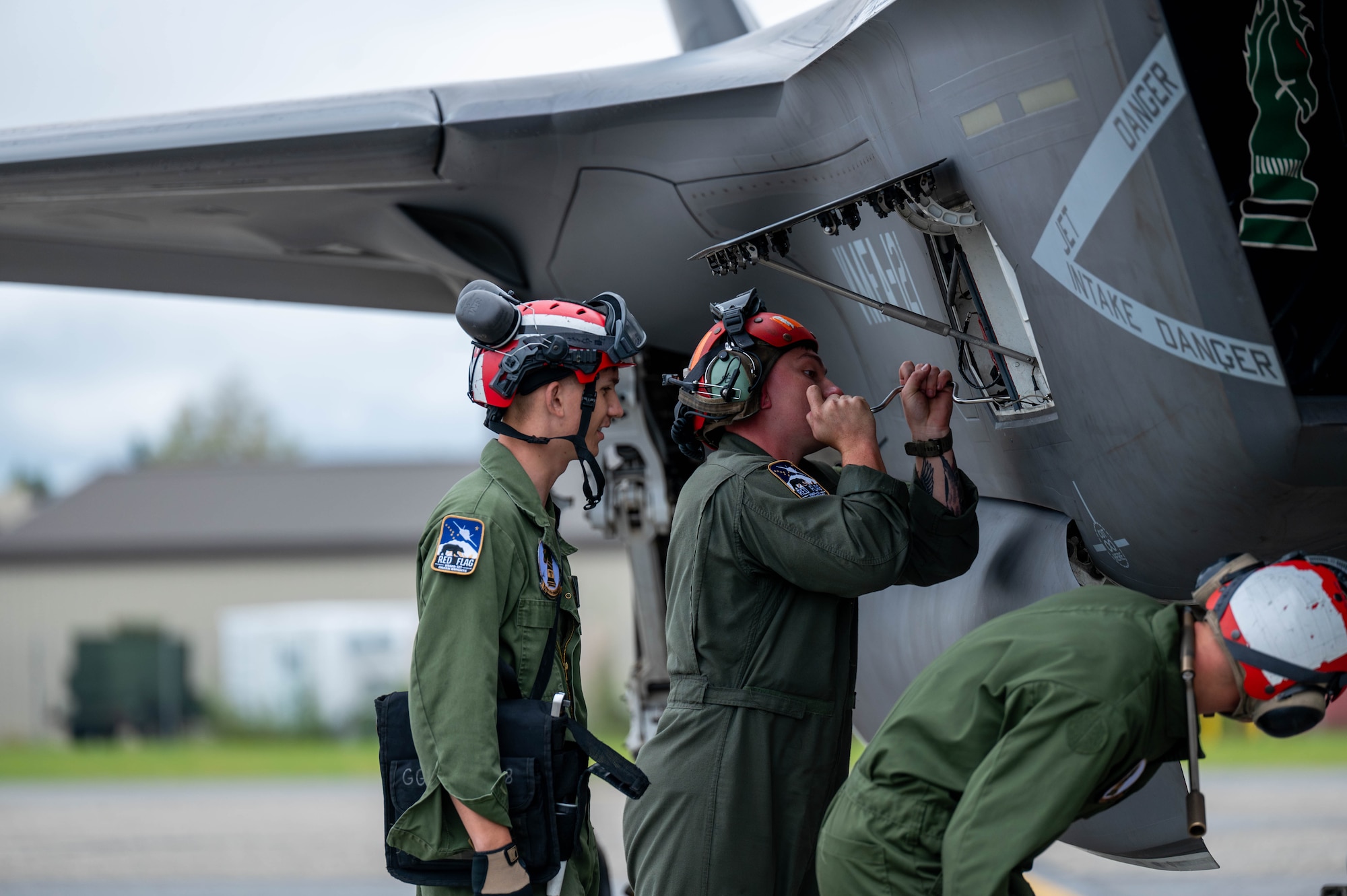 U.S. Marine Corps Marines assigned to Marine Fighter Attack Squadron 121 (VMFA-121) perform maintenance on a F-35B Lightning II during Red Flag-Alaska 25-3 at Eielson Air Force Base, Alaska, July 31, 2025.