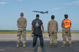 U.S. Air Force maintainers assigned to the 489th Maintenance Squadron watch as a B-1B Lancer departs Dyess Air Force Base, Texas, July 21, 2025, to participate in Red Flag-Nellis 25-3. Red Flag is the U.S. Air Force’s premier large-force combat training exercise, designed to enhance integration and readiness across joint and allied forces in a contested environment. (U.S. Air Force photo by Airman Caleb Schellenberg)