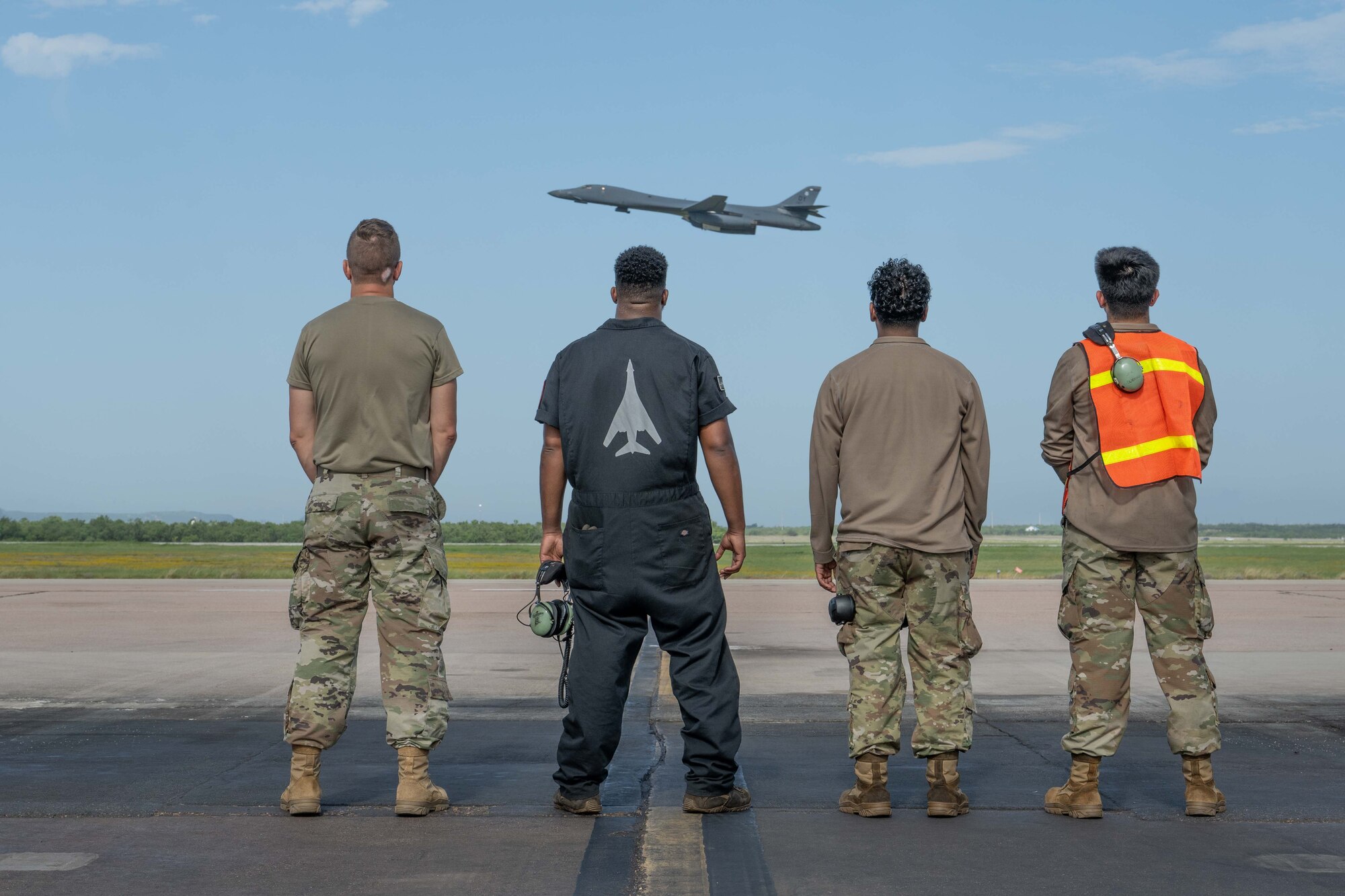 U.S. Air Force maintainers assigned to the 489th Maintenance Squadron watch as a B-1B Lancer departs Dyess Air Force Base, Texas, July 21, 2025, to participate in Red Flag-Nellis 25-3. Red Flag is the U.S. Air Force’s premier large-force combat training exercise, designed to enhance integration and readiness across joint and allied forces in a contested environment. (U.S. Air Force photo by Airman Caleb Schellenberg)