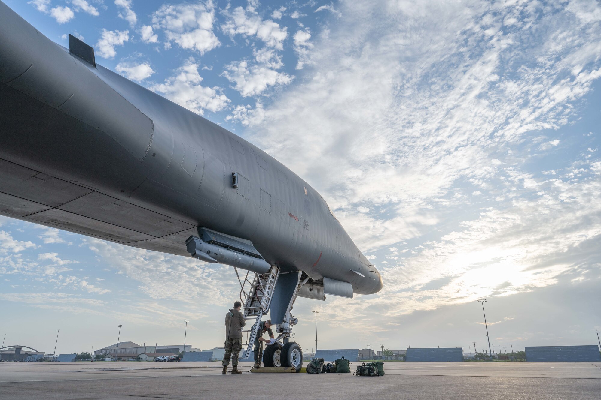 U.S. Air Force Senior Airman Isai Figueroa, 489th Maintenance Squadron crew chief, and Capt. Joseph Heyser, 345th Bomb Squadron pilot, conduct pre-flight duties on a B-1B Lancer before taking off on a mission in support of Red Flag-Nellis 25-3 at Dyess Air Force Base, Texas, July 21, 2025. Red Flag is the U.S. Air Force’s premier large-force combat training exercise, designed to enhance integration and readiness across joint and allied forces in a contested environment. (U.S. Air Force photo by Airman Caleb Schellenberg)