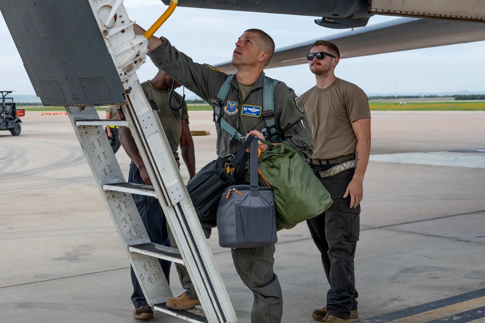 U.S. Air Force Col. Seth Spanier, 7th Bomb Wing commander, steps up the ladder of a B-1B Lancer prior to takeoff in support of Red Flag-Nellis 25-3 at Dyess Air Force Base, Texas, July 23, 2025. During Red Flag, Dyess aircrews flew daily sorties from Texas to Nevada, executing simulated strike missions in a contested, high-threat environment. (U.S. Air Force photo by Airman Caleb Schellenberg)
