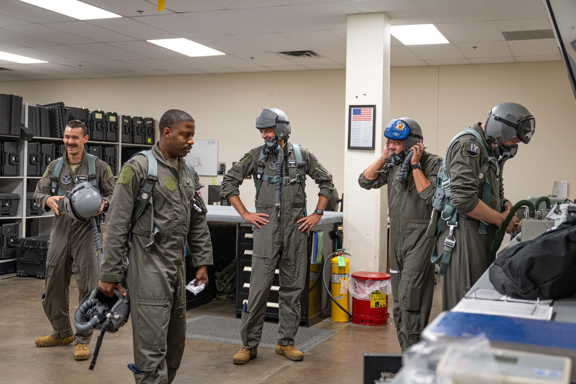 U.S. Air Force B-1B Lancer pilots from the 9th and 345th Bomb Squadron put on flight equipment in preparation for a mission in support of Red Flag-Nellis 25-3 at Dyess Air Force Base, Texas, July 25, 2025. Active duty and Reserve bomber crews from Dyess participated in Red Flag, strengthening Total Force integration and reinforcing Dyess’ ability to execute dynamic force employment. (U.S. Air Force photo by Airman Caleb Schellenberg)