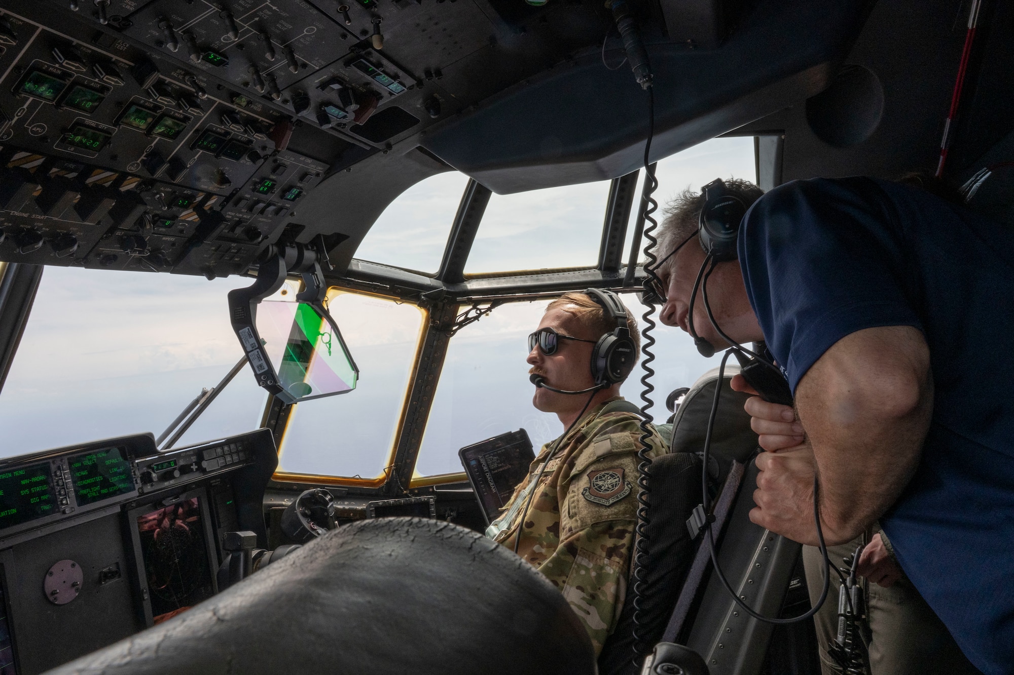 Airmen fly on a C-130J in Guam