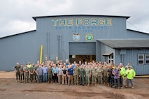 Adm. Samuel J. Paparo, commander of the U.S. Indo-Pacific Command, joins partners from Office of the Secretary of Defense, and industry for a group photo at The Forge, a new advanced manufacturing facility located on Schofield Barracks, Hawaii, July 28, 2025. USINDOPACOM is committed to enhancing stability in the Indo-Pacific region by promoting security cooperation, encouraging peaceful development, responding to contingencies, deterring aggression and, when necessary, prevailing in conflict. (U.S. Army photo by Sgt. Austin Riel)