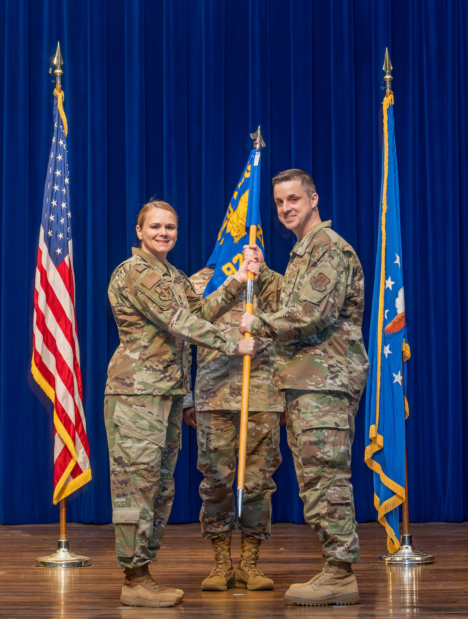 Lt. Col. Nicole Fink presents the guidon to Maj. Daniel Wright