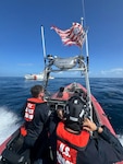 A small boat crew from the U.S. Coast Guard Cutter Richard Dixon transports survivors from an overdue vessel aboard near Mona Island, August 1, 2025. Three fisherman were reported overdue after they failed to return Las Crayolas, Puerto Rico. (U.S. Coast Guard photo)