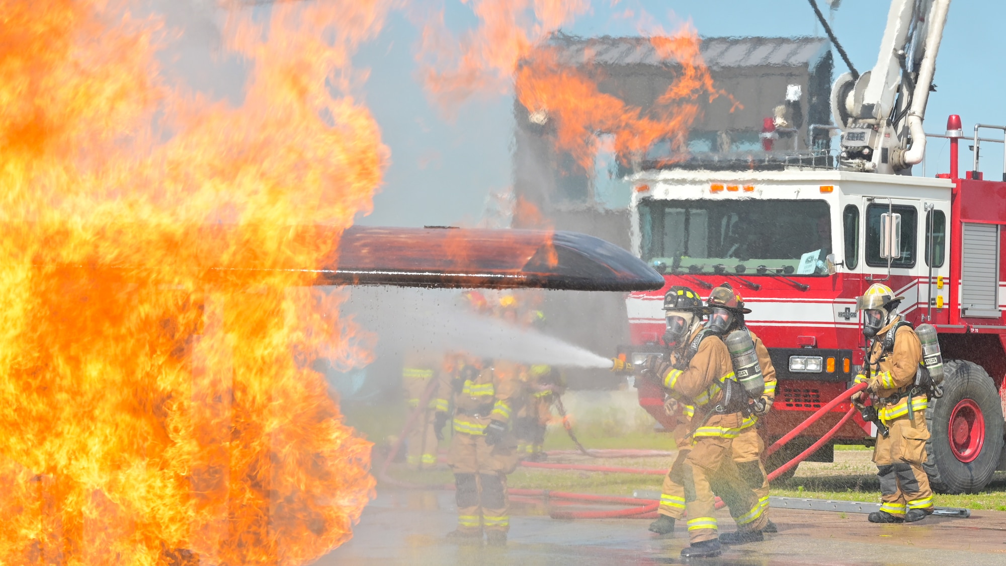 Firefighters from the 155th Civil Engineering Squadron practice fire operations, including aircraft rescue firefighting, structural firefighting, and F-16 egress training, June 18 - 20, 2025, at the 119th Regional Training Site, in Fargo, North Dakota.