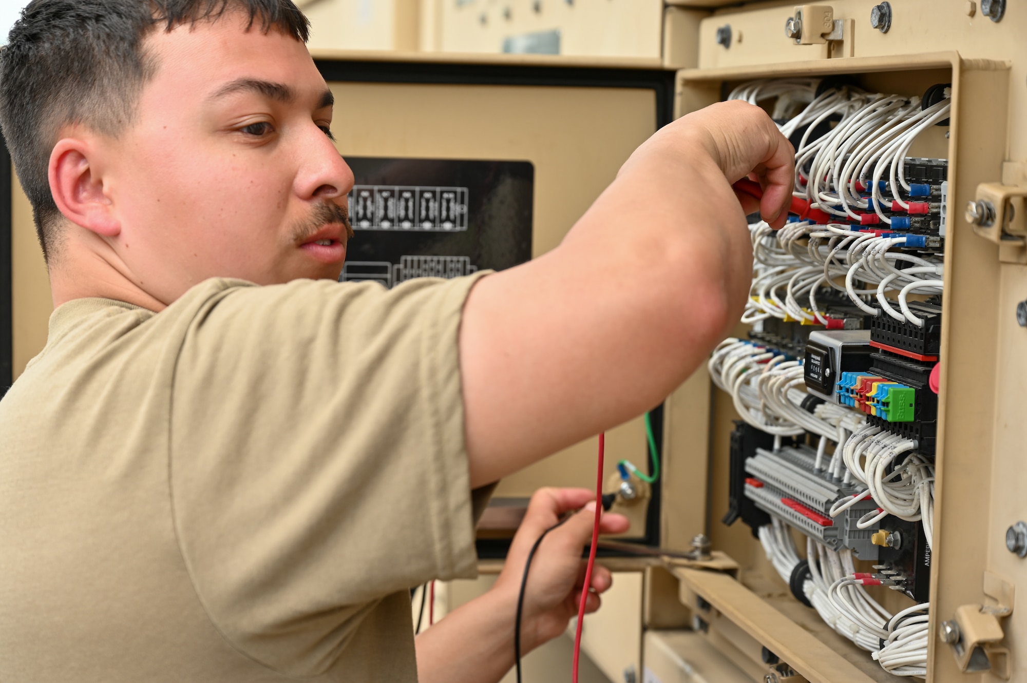 Power production Airman from the 155th Civil Engineering Squadron troubleshoots a bare power unit, June 18, 2025, at the 119th Regional Training Site, in Fargo, North Dakota.