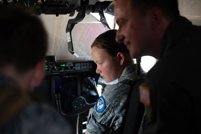 A Civil Air Patrol cadet sits in the flight pit during a tour of the base.