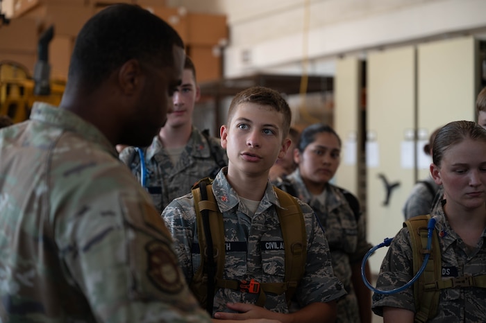 Civil Air Patrol cadets speak to an Airman from the 41st Aerial Port Squadron.