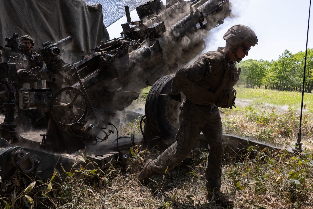 U.S. Marine Corps Cpl. Zachariah Kline fires an M777 Howitzer during Artillery Relocation Training Program 25.1 at Yausubetsu Maneuver Area, Hokkaido, Japan, June 10, 2025. ARTP, established by the 1997 Special Action Committee in Okinawa, relocates live-fire artillery training from Okinawa to mainland Japan to maintain readiness and stabilize U.S. Forces’ basing, enhancing regional security across Japan and the Indo-Pacific. This training boosts the capabilities and readiness of the Marine Corps’ only permanently forward-deployed artillery unit, enabling accurate indirect fire support. Kline, a native of New York, is a cannoneer with 3d Battalion, 12th Marines, 3d Marine Division. (U.S. Marine Corps photo by Cpl. Evelyn Doherty)