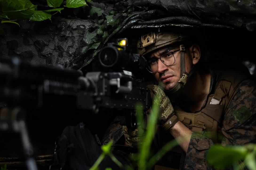 U.S. Marine Corps Lance Cpl. Sebastian Vaca mans his post with an M240B machine gun during a field training exercise at Combined Arms Training Center Camp Fuji, Japan, June 10, 2025.  The training demonstrates 3d Battalion, 12th Marine Regiment’s ability to rapidly deploy long-range fire throughout the Indo-Pacific. Vaca, a native of California, is an ammunition technician with 3d Battalion, 12th Marine Regiment, 3d Marine Division. (U.S. Marine Corps photo by Lance Cpl. Rodney Frye)