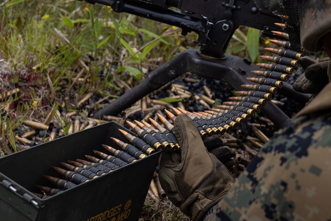 U.S. Marines prepare 7.62mm rounds during a crew-served weapons range during Artillery Relocation Training Program 25.1 at Yausubetsu Maneuver Area, Hokkaido, Japan, June 17, 2025. ARTP, established by the 1997 Special Action Committee in Okinawa, relocates live-fire artillery training from Okinawa to mainland Japan to maintain readiness and stabilize U.S. Forces’ basing, enhancing regional security across Japan and the Indo-Pacific. This training boosts the capabilities and readiness of the Marine Corps’ only permanently forward-deployed artillery unit, enabling accurate indirect fire support. The Marines are with 3d Marine Division. (U.S. Marine Corps photo by Cpl. Evelyn Doherty)