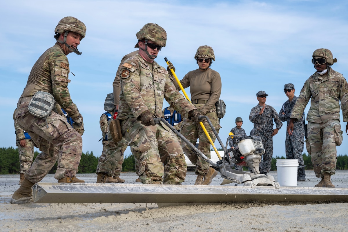 U.S. Air Force Airmen assigned to the 35th Civil Engineer Squadron smooth concrete during a rapid airfield damage repair exercise as a part of Resolute Force Pacific 2025 at Draughon Range near Misawa Air Base, Japan, July 29, 2025.