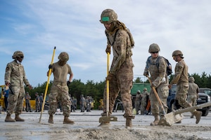 U.S. Air Force Airmen assigned to the 35th Civil Engineer Squadron smooth concrete during a rapid airfield damage repair exercise as a part of Resolute Force Pacific 2025 at Draughon Range near Misawa Air Base, Japan, July 29, 2025.