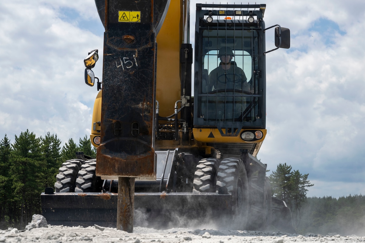 A U.S. Air Force Airman assigned  to the 35th Civil Engineer Squadron operates an excavator with impactor attachment during a rapid airfield damage repair exercise as a part of Resolute Force Pacific 2025 at Draughon Range near Misawa Air Base, Japan, July 29, 2025